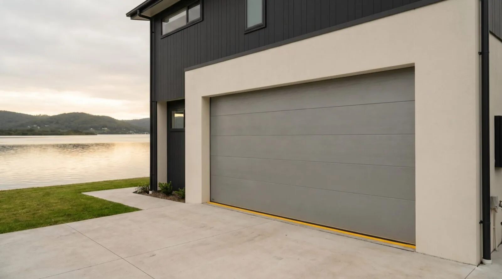 A clean modern sectional garage door on a contemporary Gosford waterfront home